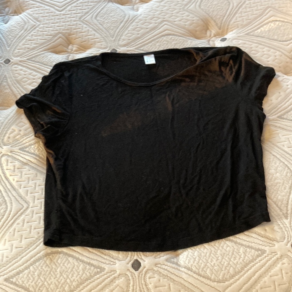 This is a loose black crop top from Von Maur